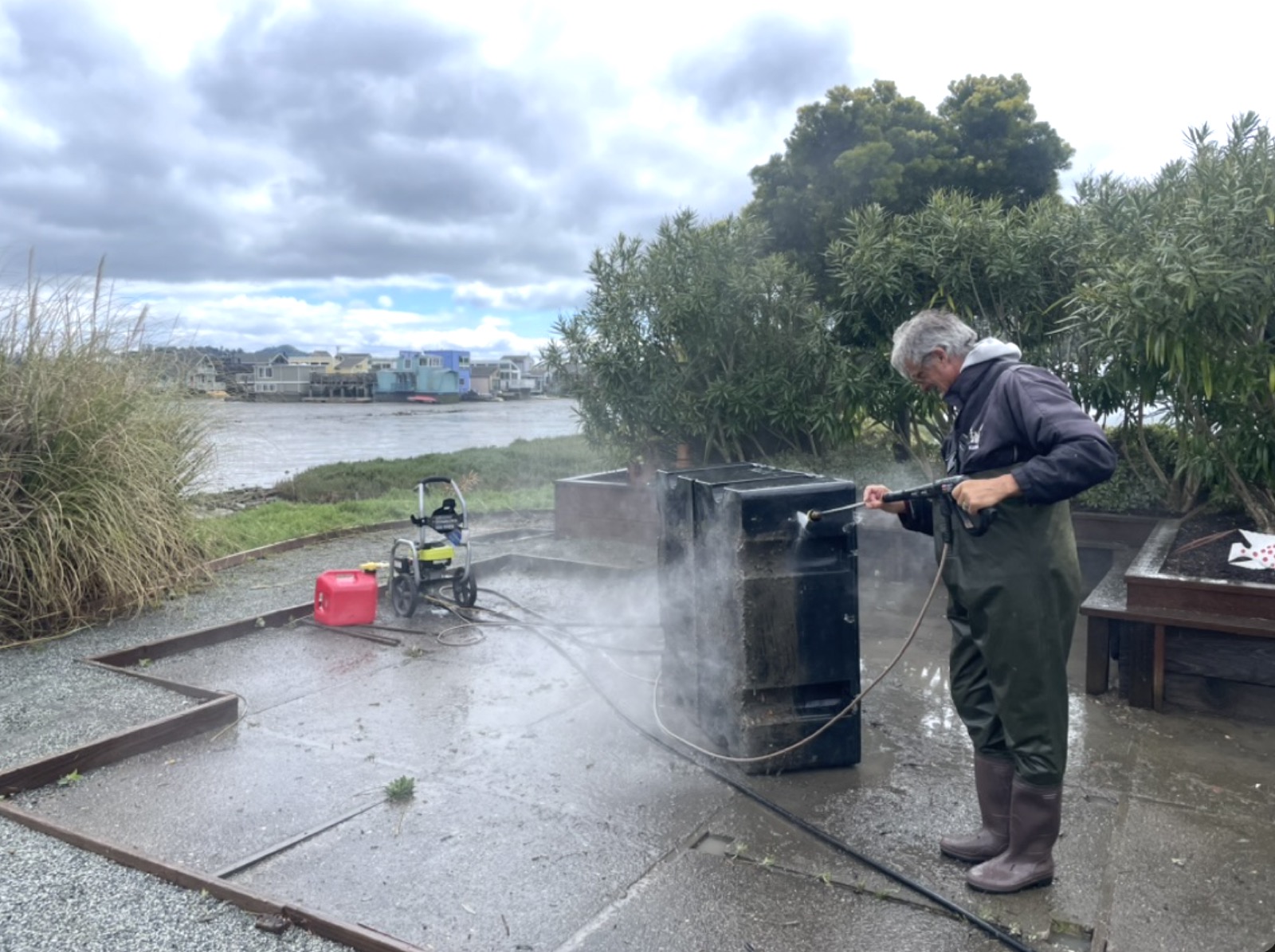 Paul Bergeron cleaning floats for a floating dock