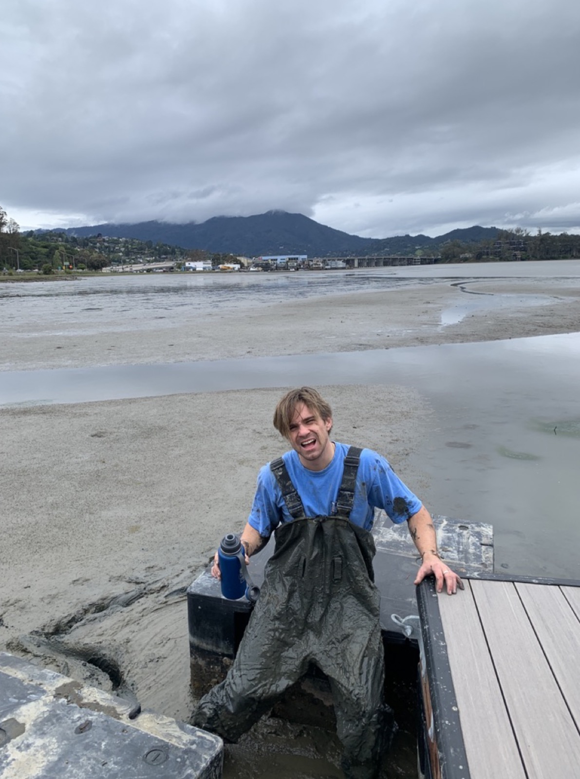 Checking under the dock at low tide on the Sausalito docks